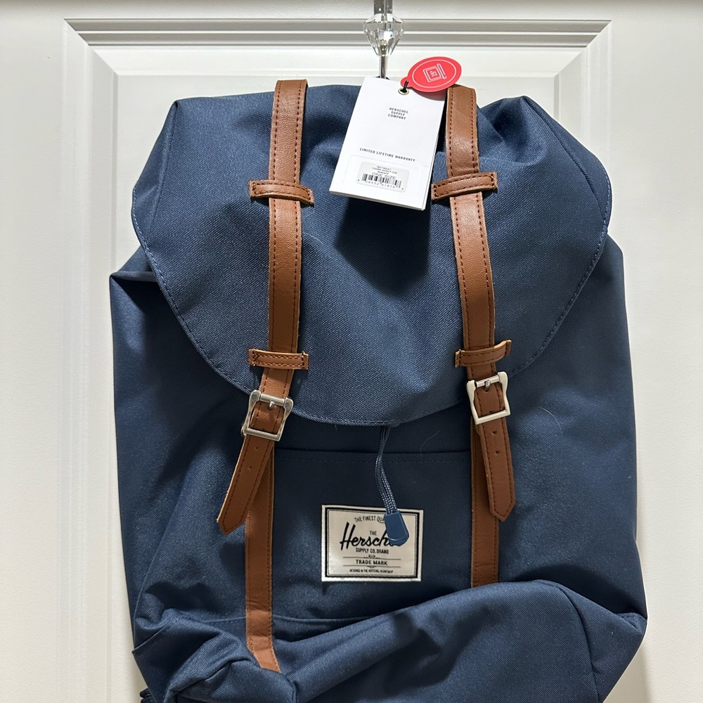 NWT HershelNavy backpack with red and white in stripe inside